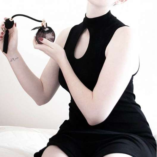 a woman wearing a black and white dress
