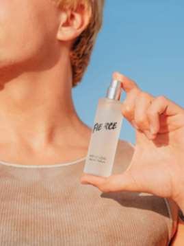 a woman is holding a book in her hand