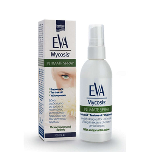 a bottle of alcohol sitting next to a book