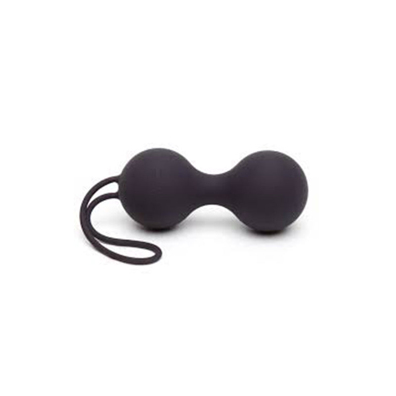 a pair of black scissors sitting on top of a table