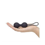 a person laying on a bench with a pair of scissors