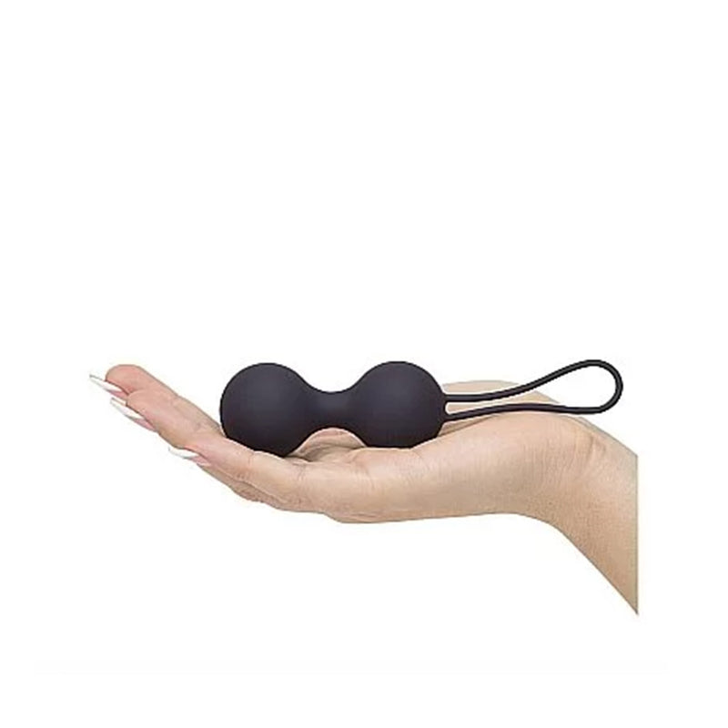 a person laying on a bench with a pair of scissors