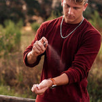 a man holding a baseball bat in his hands