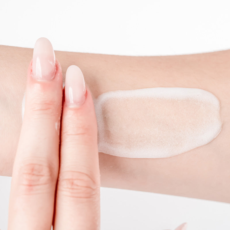 a person is holding a toothbrush in their hand