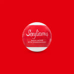 a close up of a sign on a red surface 