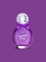 a purple cell phone sitting on a pink surface 