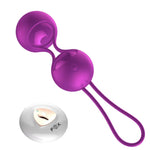 a pair of purple scissors sitting on top of a table 