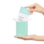 a person holding a book in their hand 