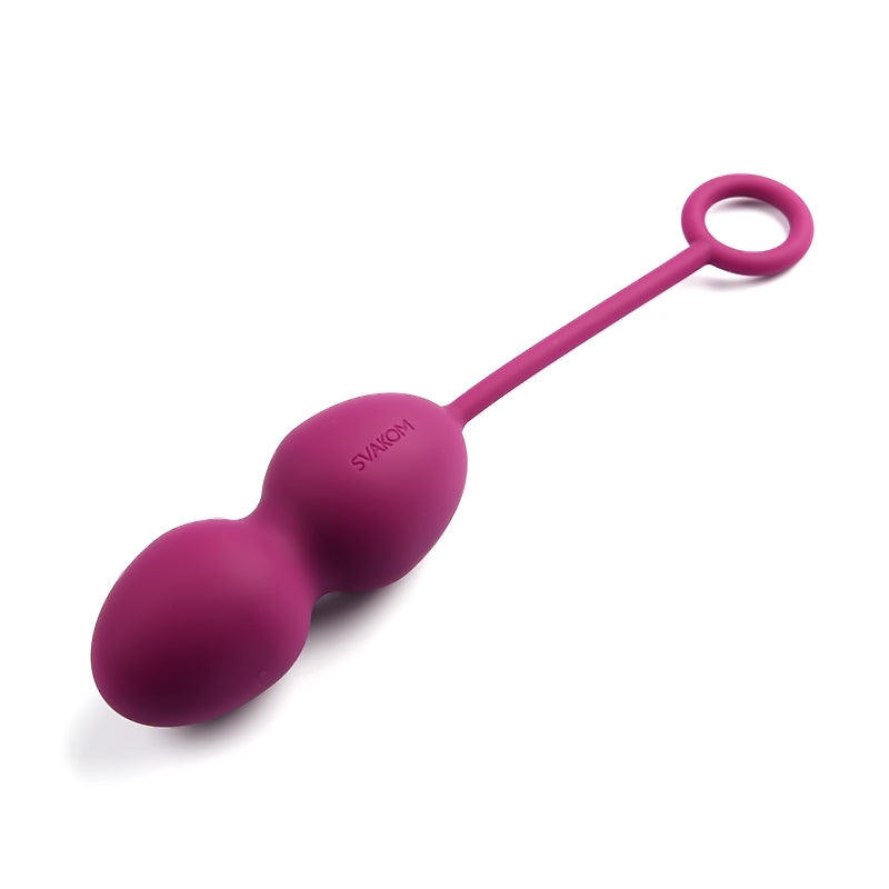 a pair of pink scissors sitting on top of a table 