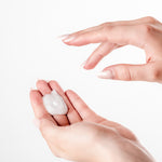 a close up of a person holding a cell phone 