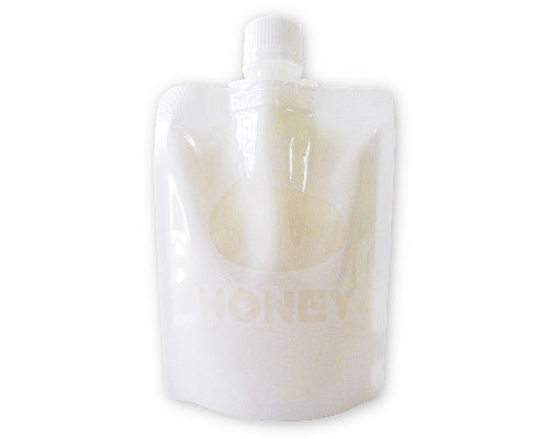 a white glass vase sitting on a table 