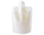a white glass vase sitting on a table 